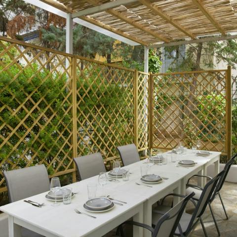 Enjoy alfresco dining in the garden's sun-shaded spot