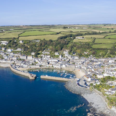 Stay in Mousehole with its rich fishing history and narrow streets filled with shops, galleries and restaurants