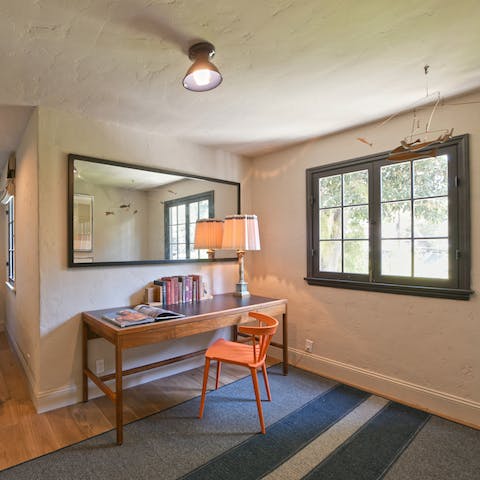 Work through your emails at the dedicated desk in the bedroom