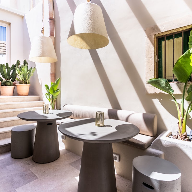 Enjoy a bottle of wine in the sunshine on the pretty courtyard