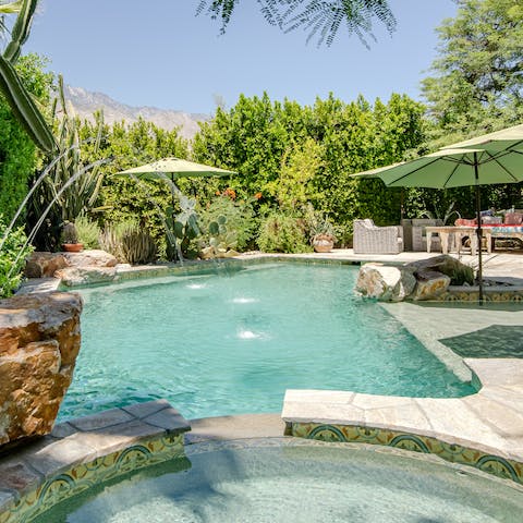 Cool off in the gorgeous pool surrounded by fountains and flora