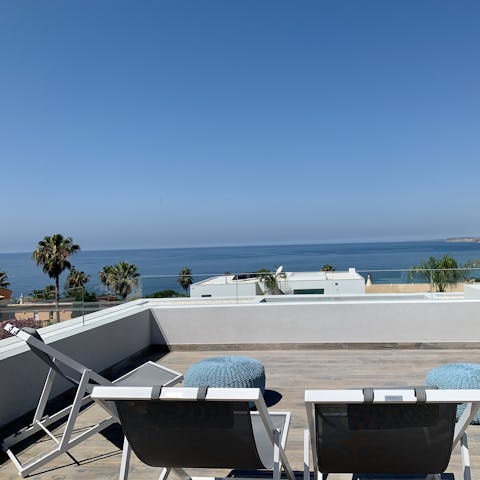 Lounge on your rooftop terrace and take in the expansive sea views