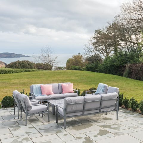 Soak up the sea views as you relax on the terrace with loved ones