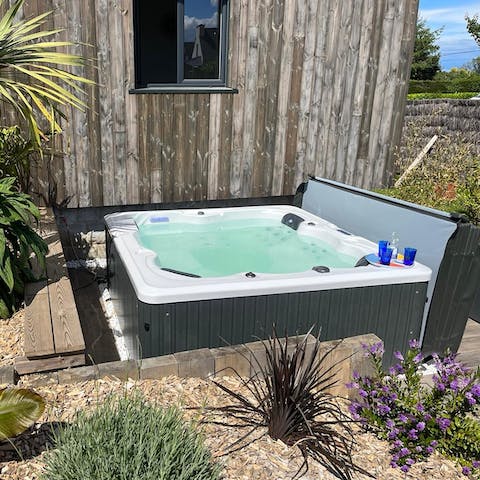 Spend balmy evenings unwinding in the private hot tub