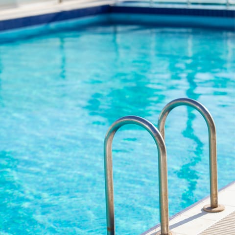 Swim in the communal pool to cool off in the Dubai heat