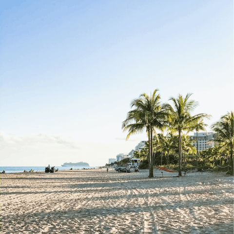 Hop on a golf cart for four minutes to hit the beach