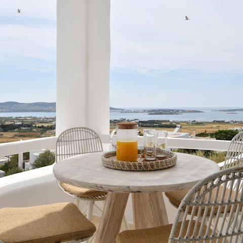Tuck in to a continental breakfast as you watch the morning light dance on the calm Aegean Sea