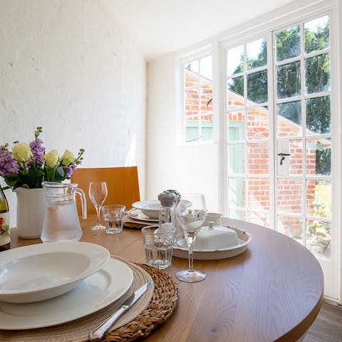 Enjoy a meal in your peaceful sunroom, with views out to the garden