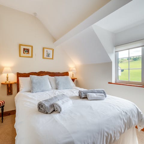 Wake up to beautiful farmland views in the main bedroom