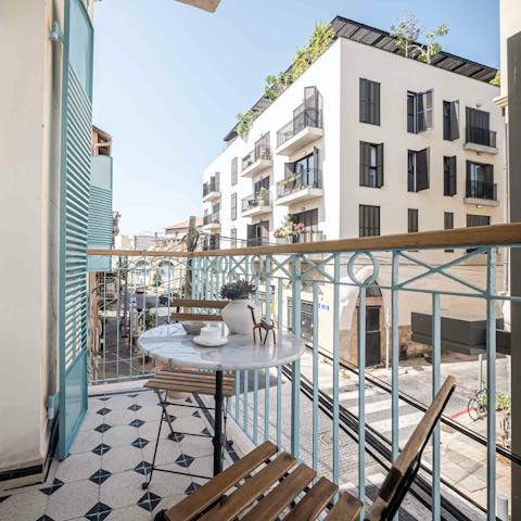Sit out on the private balcony with a glass of arak