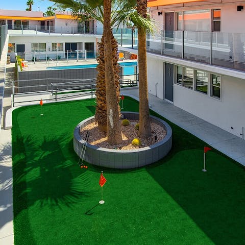 Try your hand on the mini-golf course after a swim
