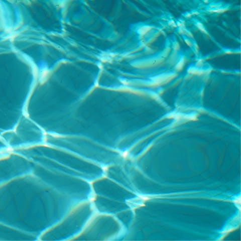 Enjoy refreshing dips in the communal swimming pool