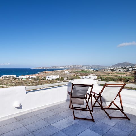 Relax on a deckchair with an ice-cold drink in hand and watch the world pass by
