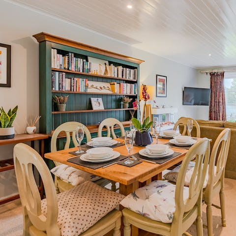 Share family dinners around the rustic dining table after a busy day in the sun