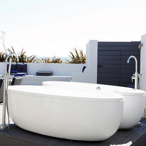 Take a luxurious soak in the freestanding outdoor bathtubs