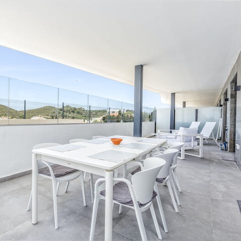 Treat guests to an alfresco banquet out on the apartment's terrace