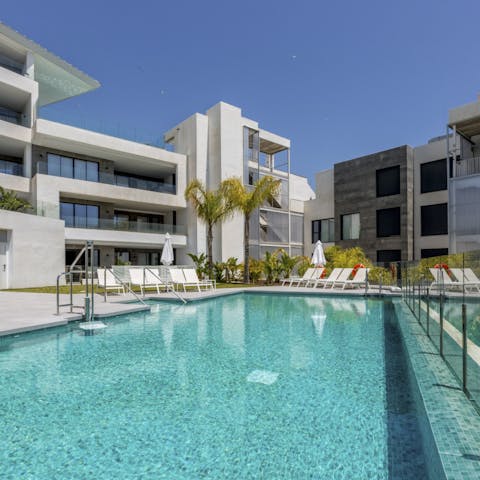 Splash about in one of the building's two swimming pools