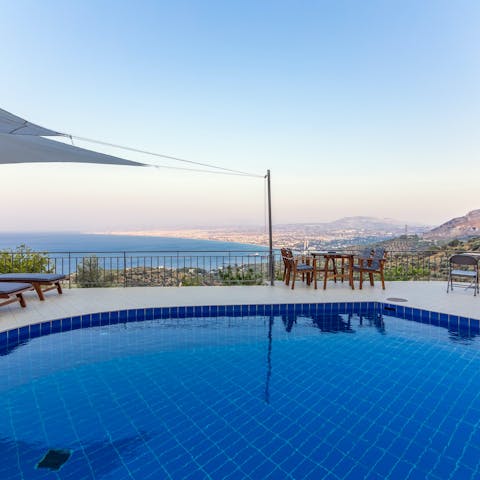 Slip into the private pool and enjoy a view over the bay