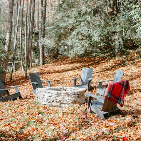 Toast marshmallows around the fire pit as stars break out above