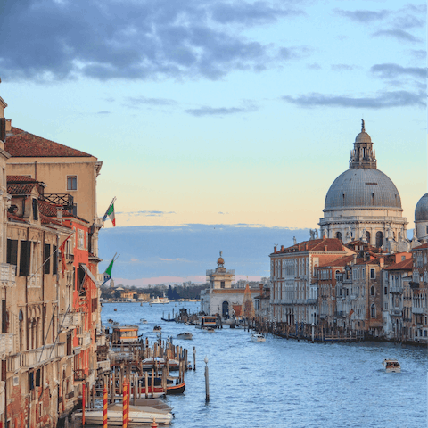 Discover the winding canals and historic landmarks of Venice
