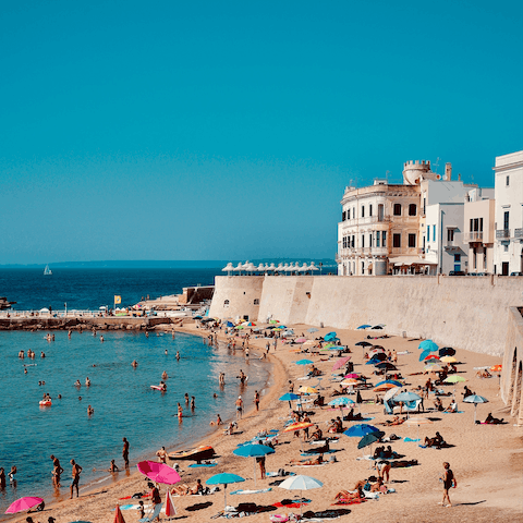 Pack a picnic and wander four minutes down to the Spiaggia della Purità