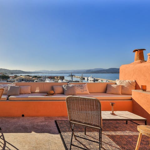Watch the yachts coming and going in the harbour from the private terrace