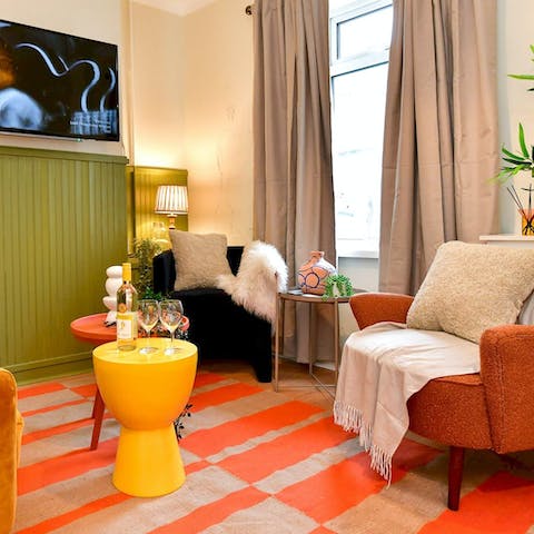 Enjoy a drink in the home's 70s-style living room before heading out