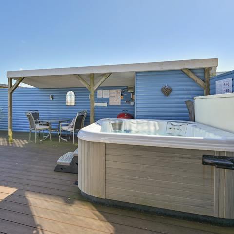 Soak up the lake views from the bubbling hot tub