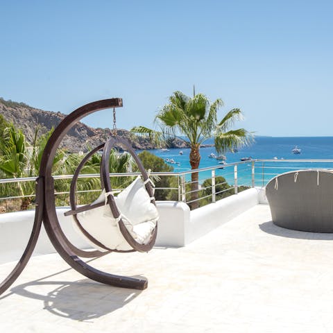 Drink in the gorgeous view of the Mediterranean Sea from the swing chair on the terrace