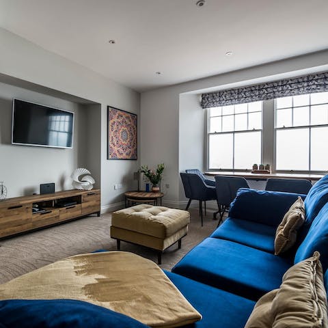 Snuggle up on the blue velvet couch for a Netflix movie night