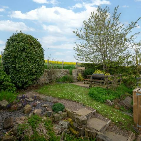 Enjoy lunch outside in the private garden overlooking the fields