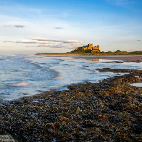 Make the ten-minute drive to Bamburgh for a beautiful beachside castle