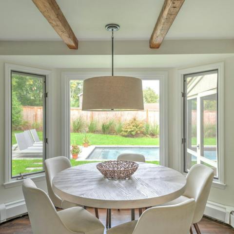 Tuck into a homecooked seafood feast at the dining table in the bay window
