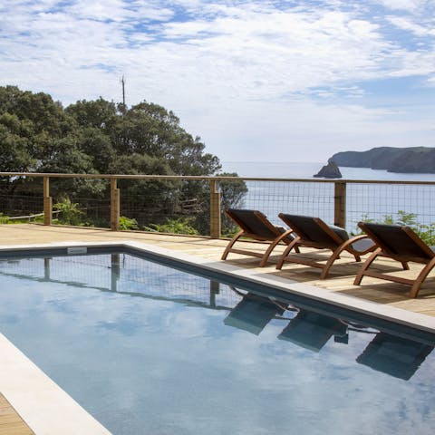 Admire stunning water views from the poolside