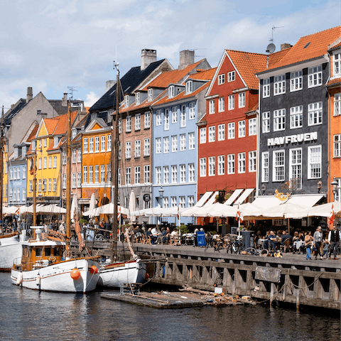 Hop over the bridge to Nyhavn Harbour, just a stroll away