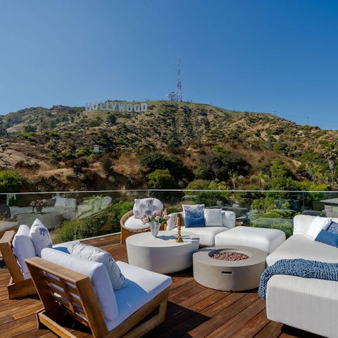 Sip cocktails while drinking in the magnificent view of the Hollywood Sign