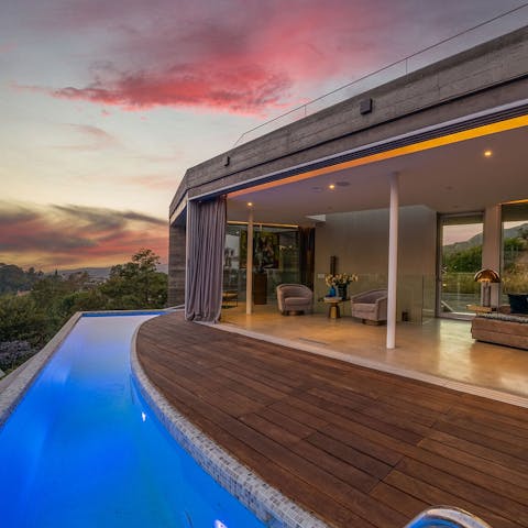 Swim laps in the private pool as the sun sets