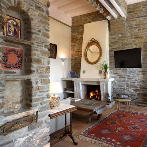 Admire the antiques and curios in the living space as you snuggle in front of the fire