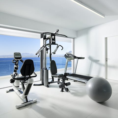 Start every morning with a workout in the gym while watching the sea