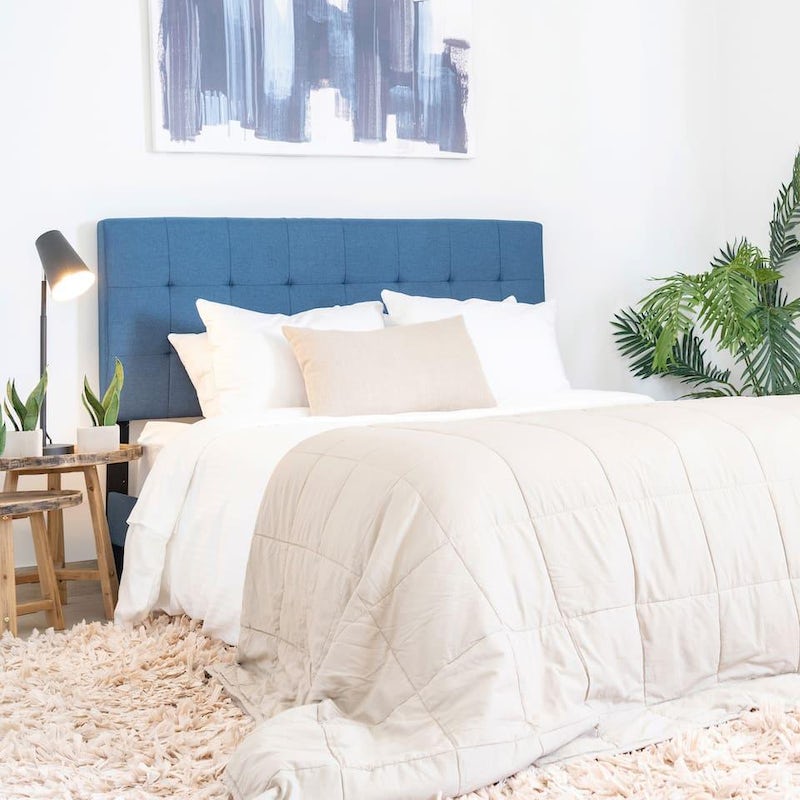 Fall asleep in the calming ocean-inspired bedroom after a full day at the beach