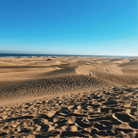 Explore the Maspalomas Dunes, less than a five-minute drive away