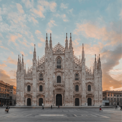Admire the impressive sight of the Duomo as the sun sets
