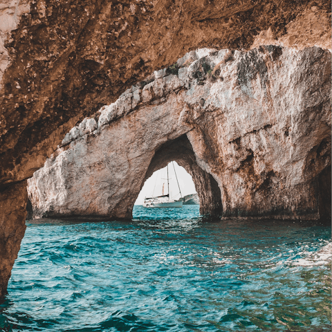 Hop on a boat to take a tour of the Blue Caves