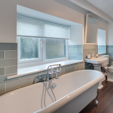 Unwind in the free-standing double ended bathtub with plenty of room for two