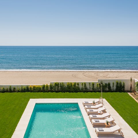 Spend lazy days drifting between the beach and the pool 