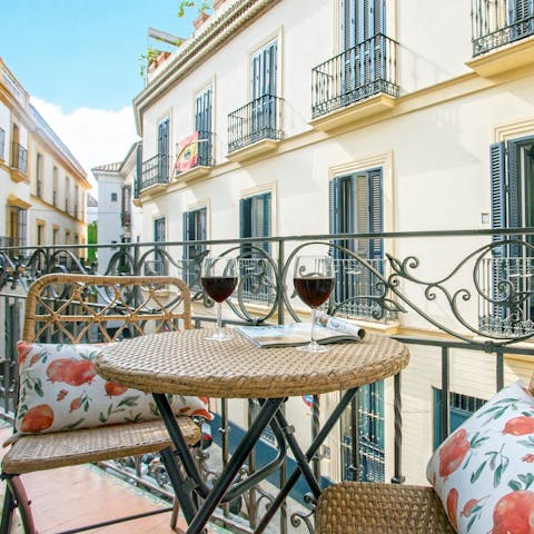 Enjoy a late afternoon tipple on your balcony, overlooking the streets below
