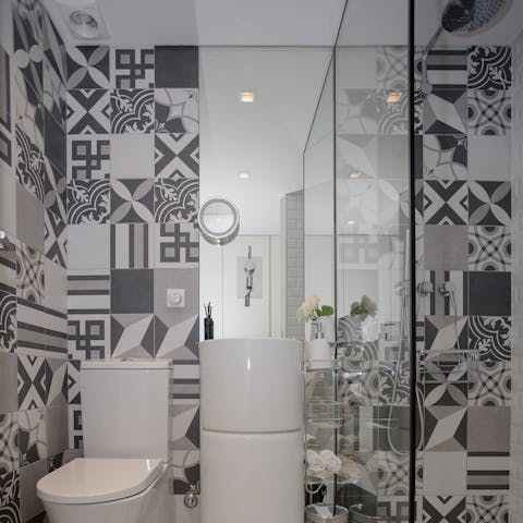 Start mornings with a luxurious soak under the tiled bathroom's rainfall shower