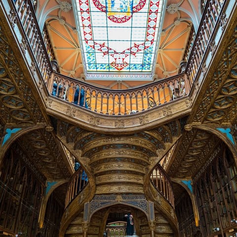 Take in the ornate beauty of the Livraria Lello bookshop, an eight-minute walk away