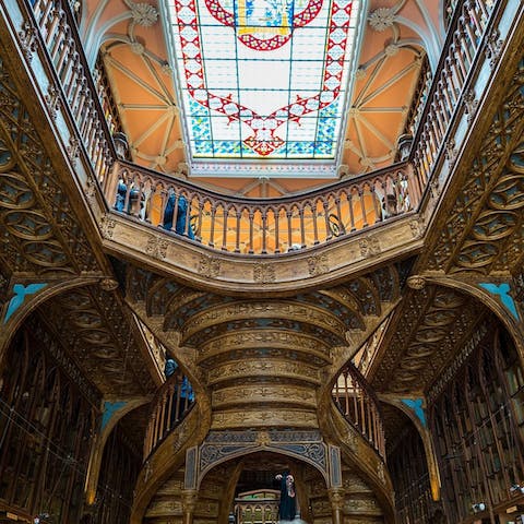 Take in the ornate beauty of the Livraria Lello bookshop, an eight-minute walk away