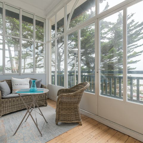 Sip your morning coffee on the enclosed veranda